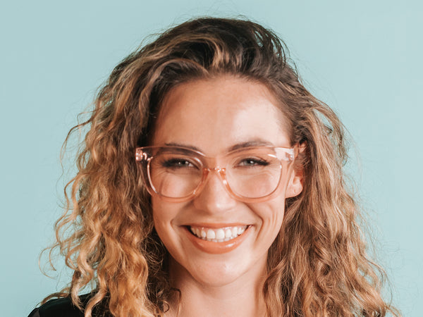 Woman wearing Reading Glasses 'Encore' Transparent Pink