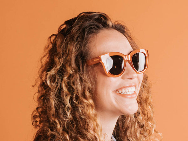 Woman wearing Sunglasses Polarised 'Encore' Muted Orange